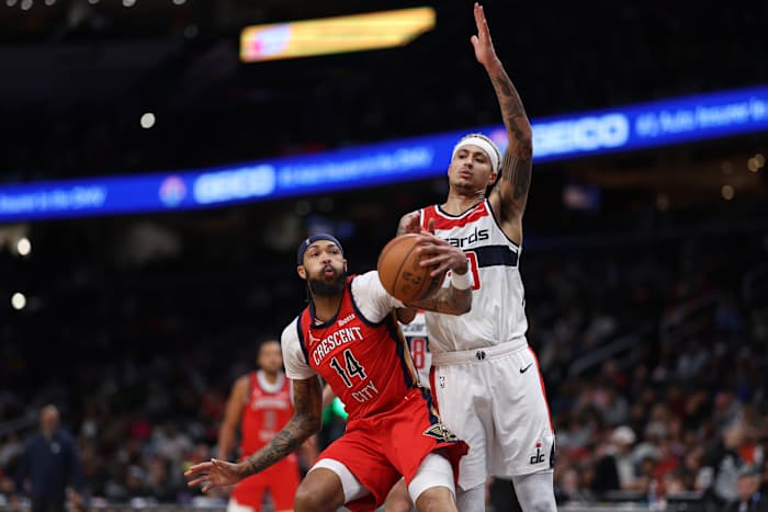 New Orleans Pelicans forward Brandon Ingram (14) fakes Washington Wizards forward Kyle Kuzma (33) in the third quarter at Capital One Arena.